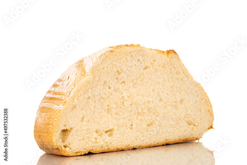 One half of a loaf of fresh fragrant white wheat bread, macro, isolated on a white background.