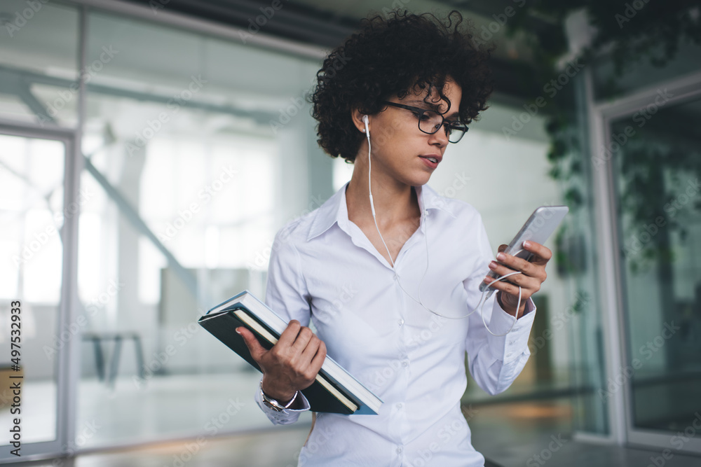 Millennial business woman use smartphone in office Millennial business woman use smartphone in office