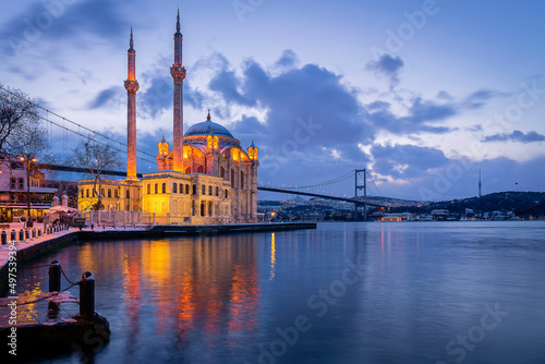 Ortakoy Mosque and Bosphorus Bridge at sunrise in winter photo