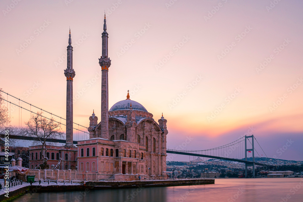 Ortakoy Mosque and Bosphorus Bridge at sunrise in winter