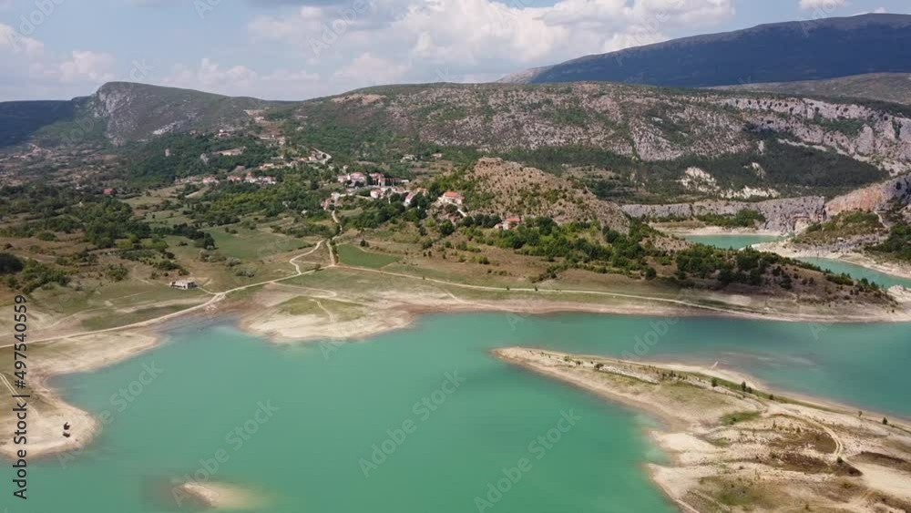 Ricice, Prolozac, Croatia - Aerial Drone View of Blue Lake Water Reservoir and Mountain Village along the Border of Bosnia Herzegovina - An Undiscovered Hidden Gem Ricice, Prolozac, Croatia - Aerial Drone View of Blue Lake Water Reservoir and Mountain Village along the Border of Bosnia Herzegovina - An Undiscovered Hidden Gem