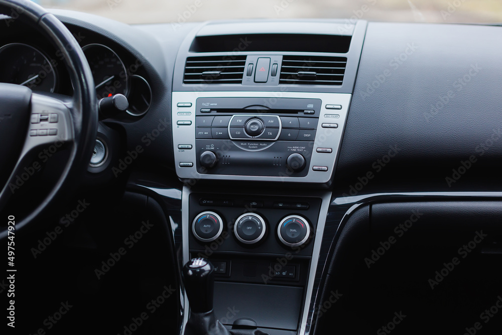 Car control panel of audio player and other devices.