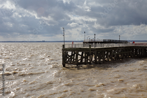 View of a pier againt the cloudy sky. photo