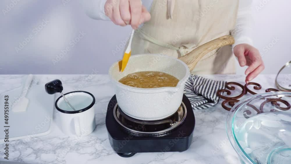 Step by step. Caramelizing sugar in a small cooking pot over the small ...