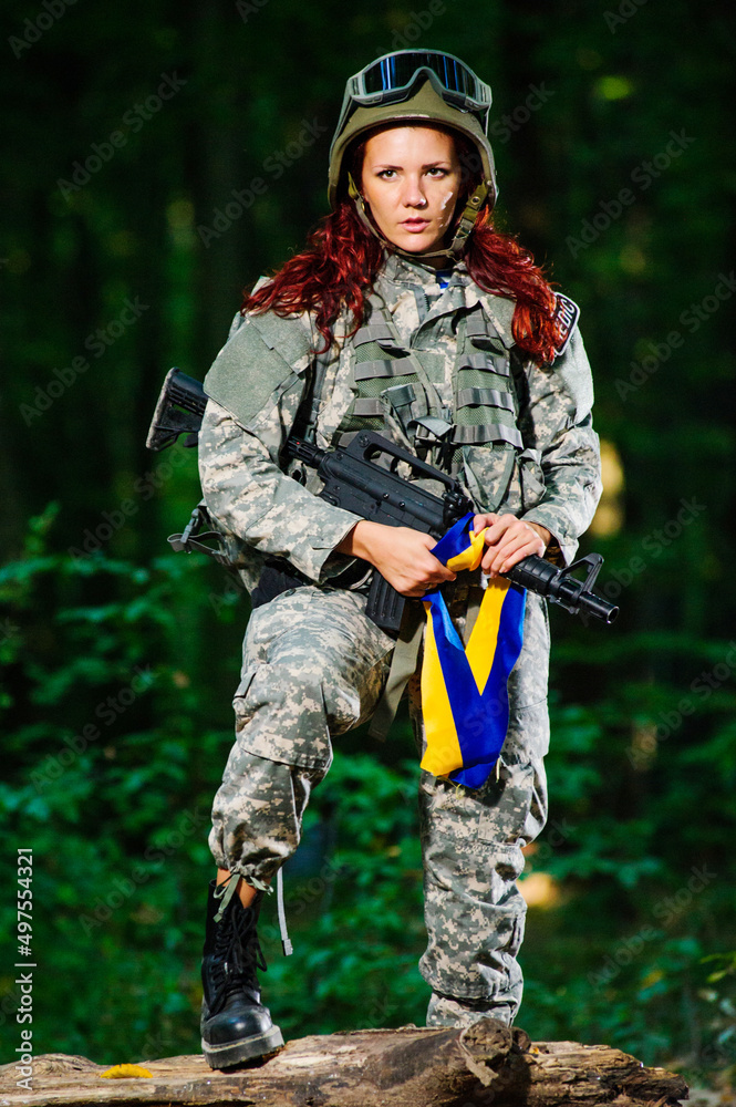 Ukranian female soldier in the forest