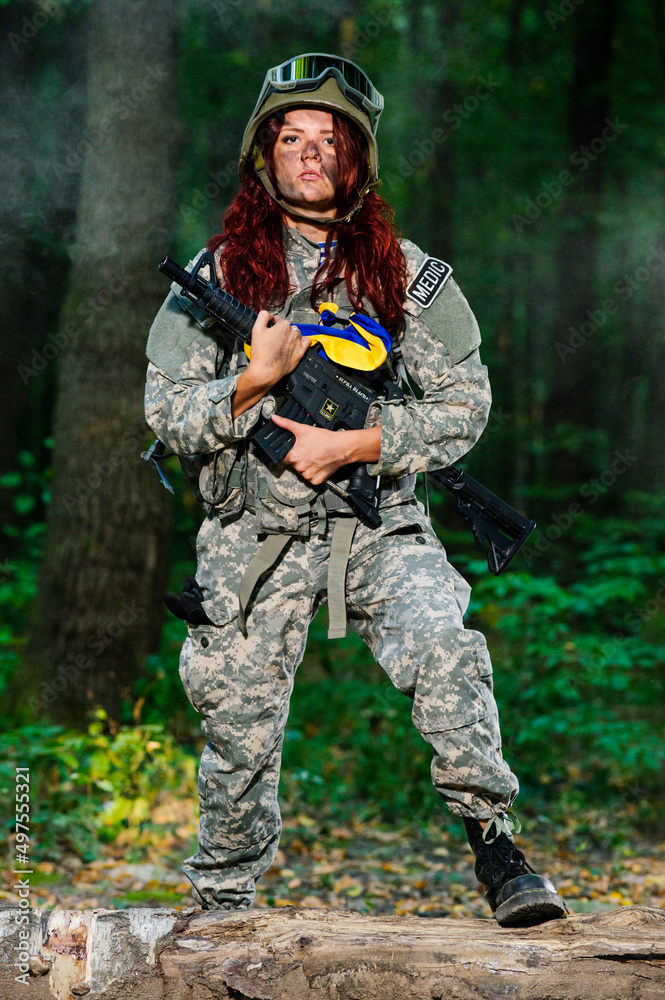 Ukranian female soldier in the forest
