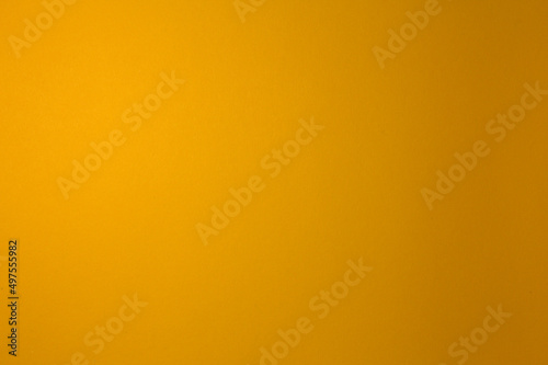 Yellow is dark. Paper background. Illuminated evenly. Homogeneous.