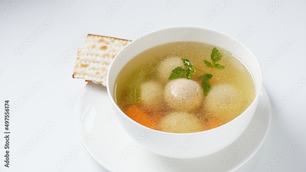 Jewish chicken broth with kneidlach (balls made with matzo meal)Matzo ball soup