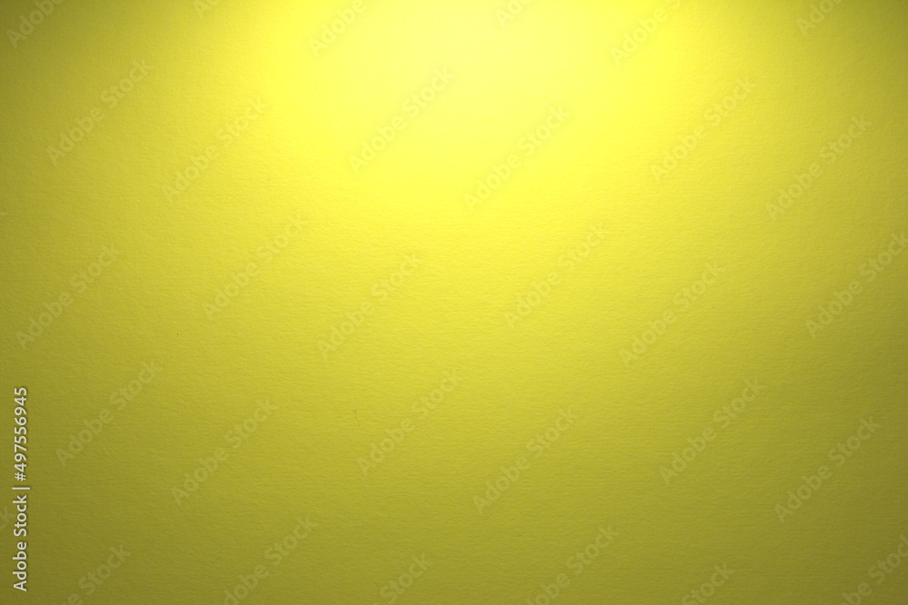 Yellow paper background. The light shines from above.
