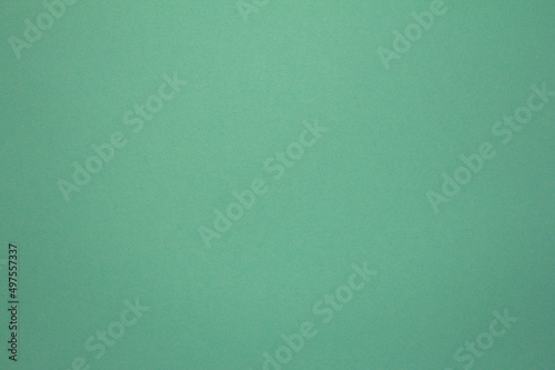 Turquoise clear. Paper background. Illuminated evenly. Homogeneously.
