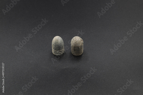 Antique lead bullets on black background photo