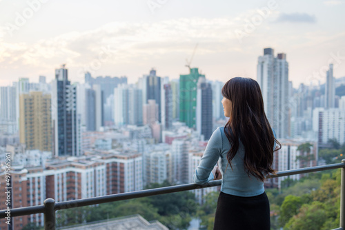 Woman look at the city view on mountain