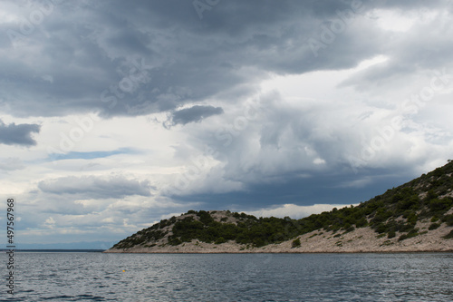 Cloudy sky with various shades of blue color over the Adriatic sea, in Dalmatia, Croatia © amilat
