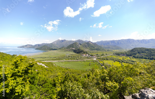 Calm Shkodra Lake and the surronding green hills in Virpazar, Montenegro photo