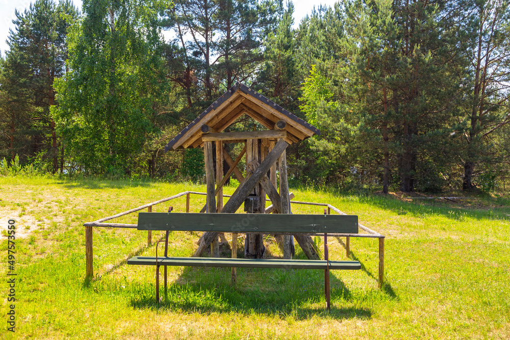 A rural, wooden gazebo. Front bench, Wdzydze Kiszewskie, Poland. A rural, wooden gazebo. Front bench, Wdzydze Kiszewskie, Poland.