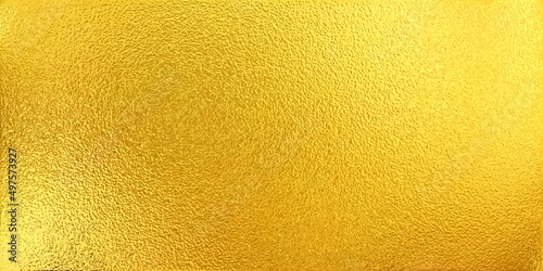 Gold shiny surface. Metal texture. Gold abstract background or wallpaper for design with copy space for your text. 