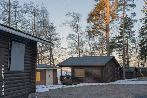 Finland Venesilta. April 3, 2022. Camping for tourists. Wooden houses. Winter landscape. © M.V.schiuma