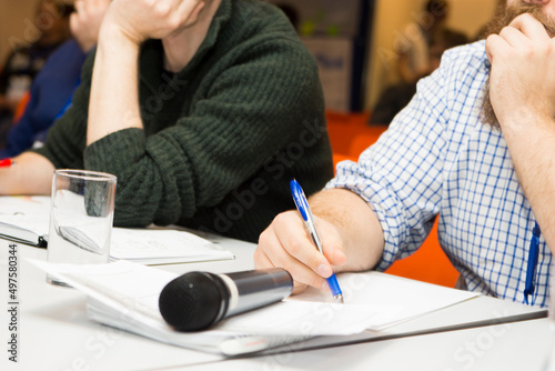 person writing on a notebook