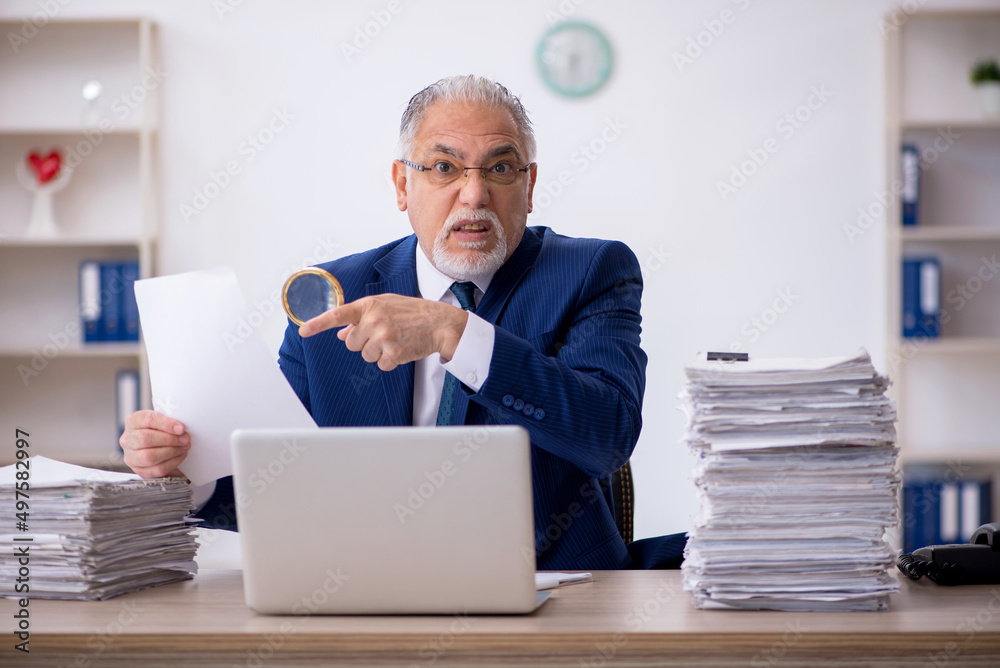 Old male employee and too much work in the office Old male employee and too much work in the office