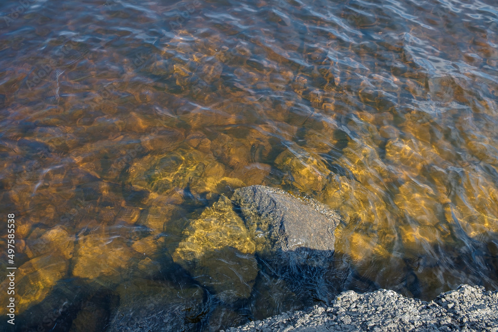 Bank of the Dnieper River. Waves hit the rocky shore