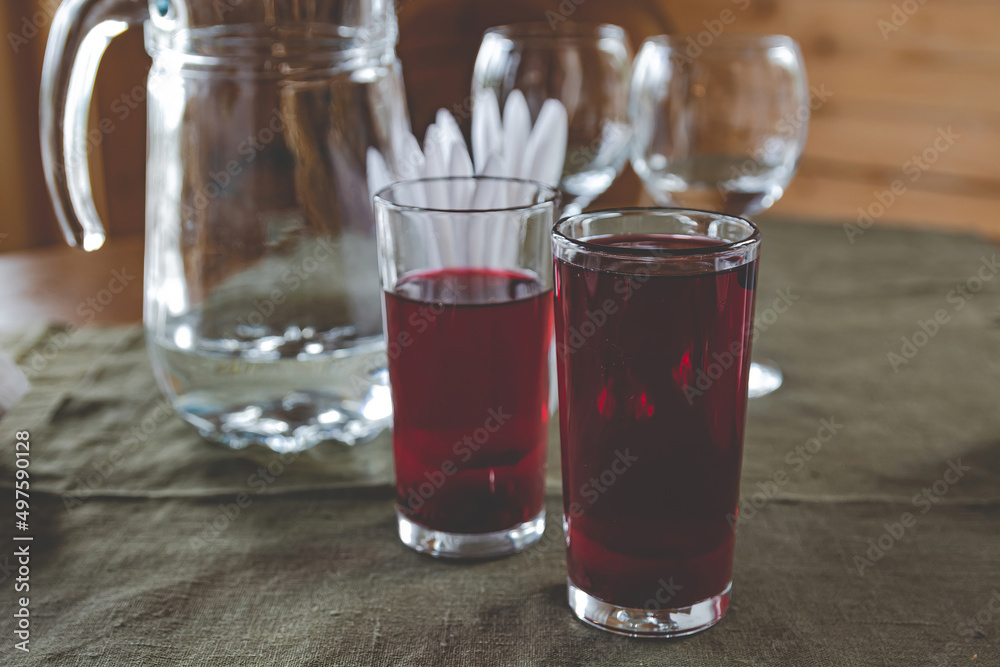 On the table are glass glasses with a fruit drink of berries. Healthy breakfast that gives a lot of energy. Healthy lifestyle