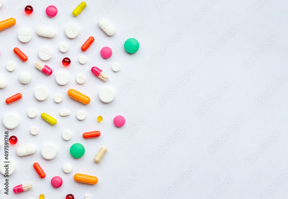 Many different pills on white background, flat lay.Global Pharmaceutical Industry and Medicinal Products - Colorful Pills, Tablets and Capsules, medicine and drug concept.copy space Many different pills on white background, flat lay.Global Pharmaceutical Industry and Medicinal Products - Colorful Pills, Tablets and Capsules, medicine and drug concept.copy space