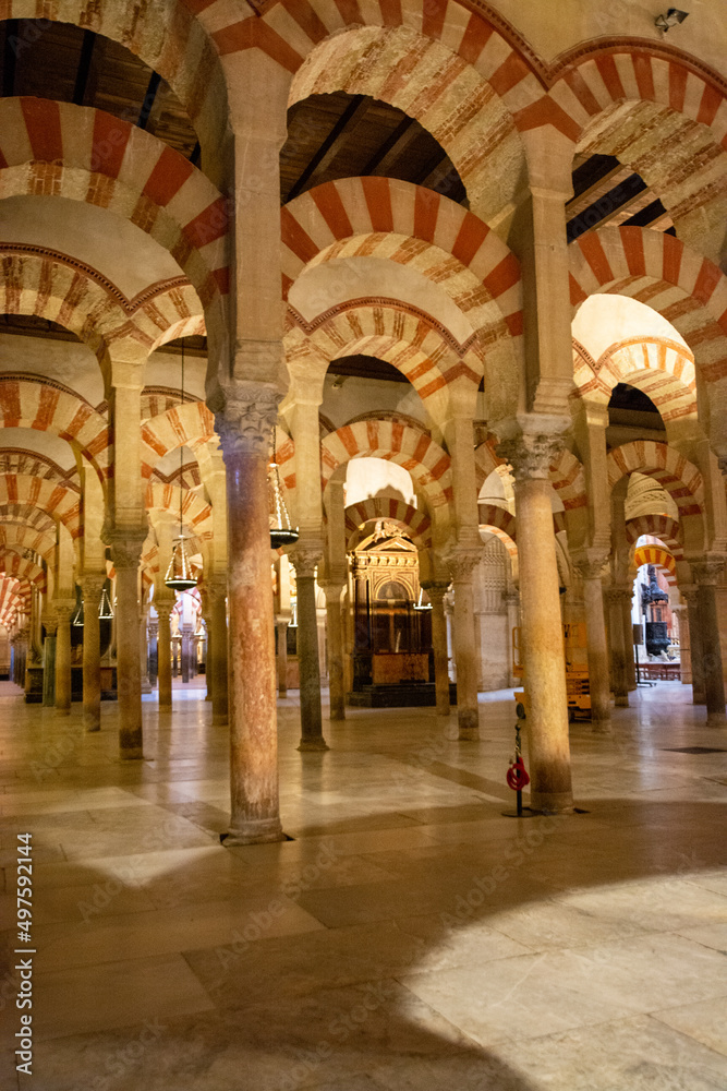 Medieval moorish architecture, colorful achways with columns in old mosque in Cordoba with no people, Andalusia, Spain
