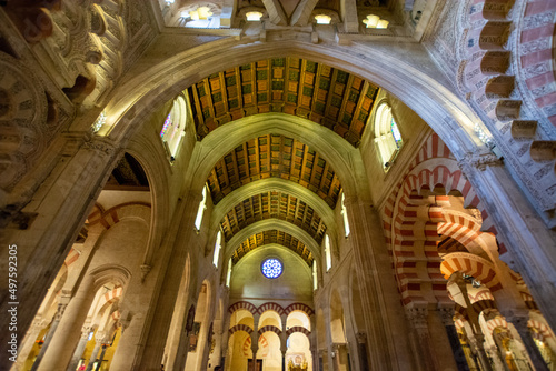 Medieval moorish architecture, colorful achways with columns in old mosque in Cordoba with no people, Andalusia, Spain photo