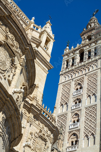 Old historical Andalusian town Seville, Spain. View on architectural details of Gothic cathedral church. © barmalini