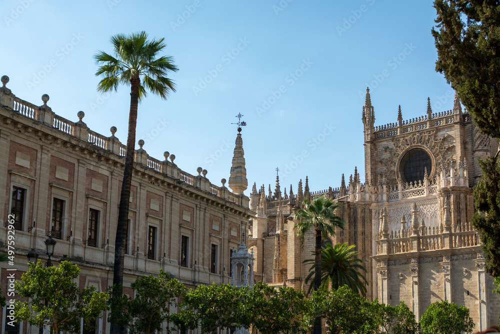 Old historical Andalusian town Seville, Spain. View on architectural details of Gothic cathedral church.