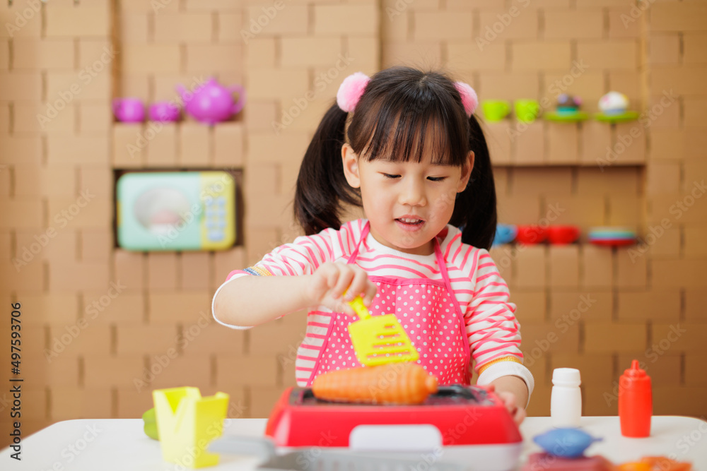 young girl pretend playing food preparing at home young girl pretend playing food preparing at home