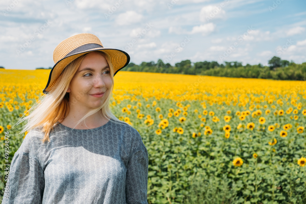 Ukrainian girl young woman on the background of sunflowers field. Ukraine Sunflowers National Symbol and Major Crop. Ukraine Win, Reconstruction plan for Ukraine