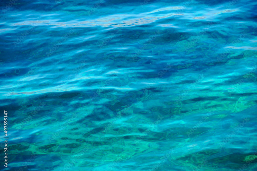 The seabed that can be seen through the transparent blue-green sea water The seabed that can be seen through the transparent blue-green sea water