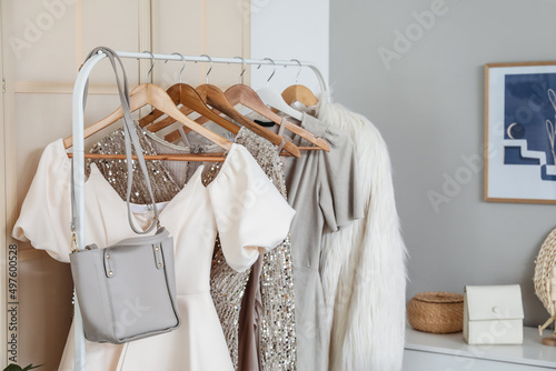 Rack with stylish clothes i...