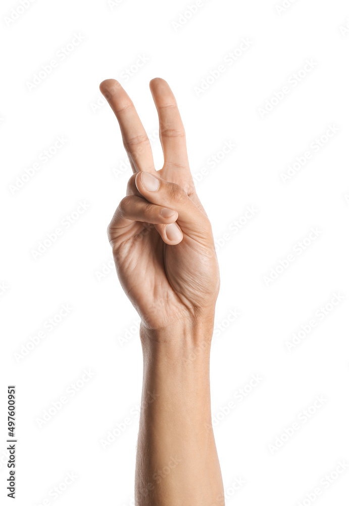 Young male hand showing victory gesture on white background