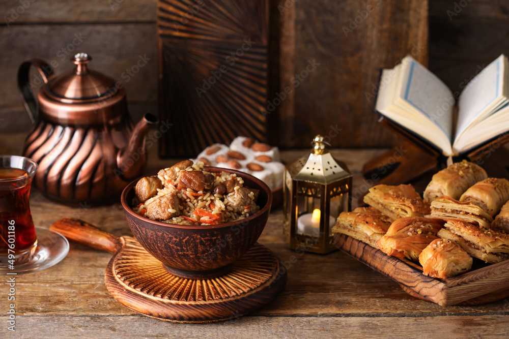 Traditional Eastern dishes on wooden background