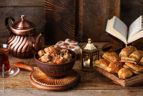 Traditional Eastern dishes on wooden background