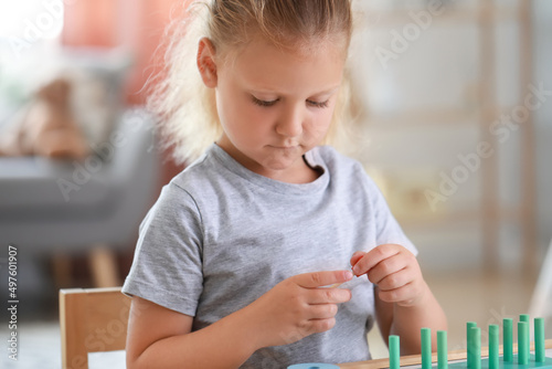 Cute little girl playing wi...