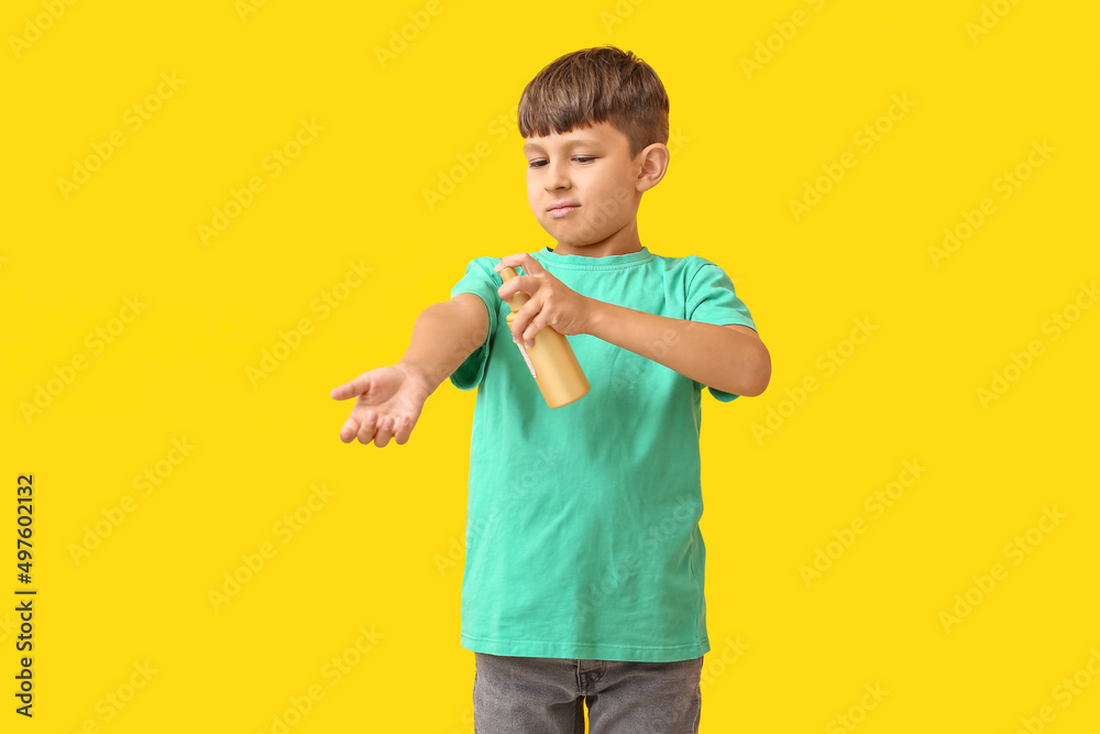 Little boy with mosquito repellent on color background Little boy with mosquito repellent on color background