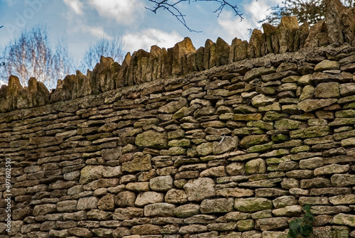 Top of dry stone contry house garden wall closeup photo