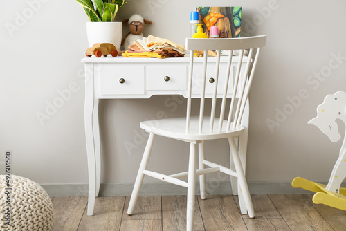 Table with baby clothes, to...