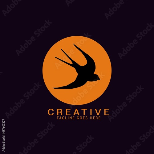 swallow bird logo template design at sunset