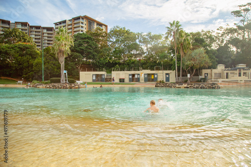 Kids swimming at the Settlement Cove Lagoon swimming pool in Redcliffe, QLD Australia photo