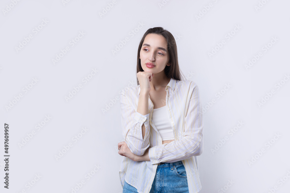 Portrait of a beautiful young woman thinking, isolated on white background Portrait of a beautiful young woman thinking, isolated on white background