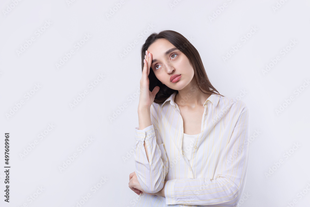 Portrait of a beautiful young woman thinking, isolated on white background Portrait of a beautiful young woman thinking, isolated on white background