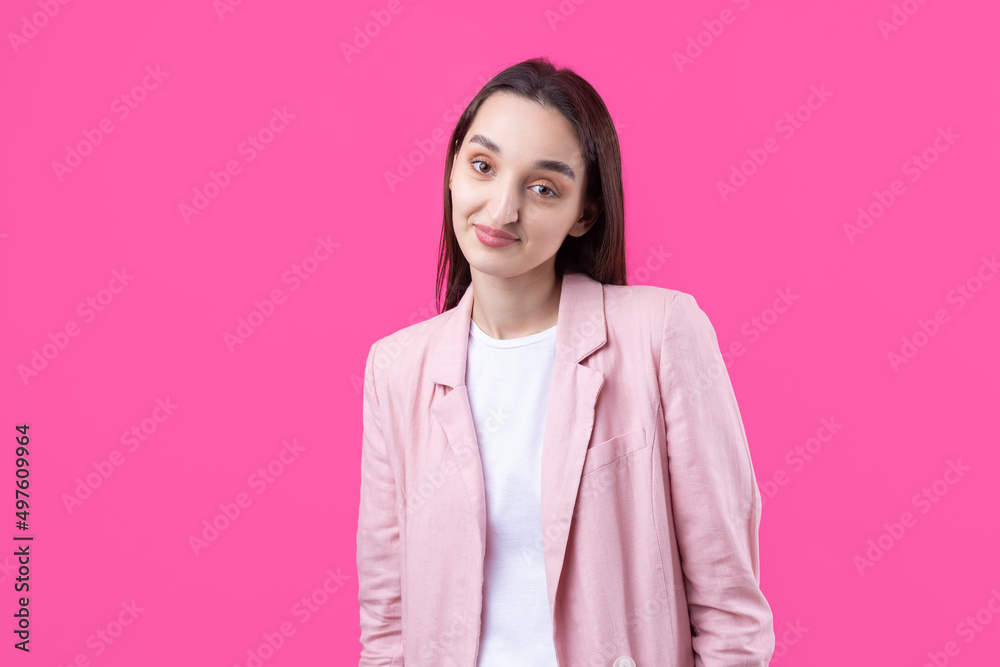 Portrait of beautiful young woman in pink jacket thinking isolated on red background Portrait of beautiful young woman in pink jacket thinking isolated on red background