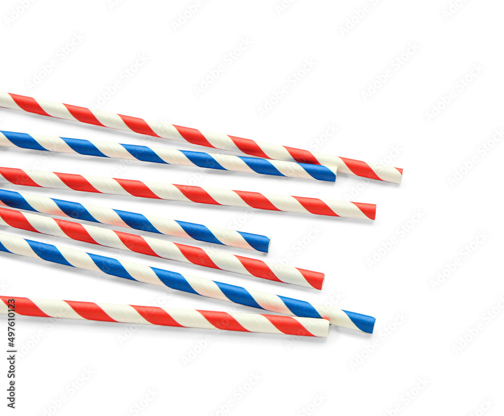 Stylish straws for drinks on white background