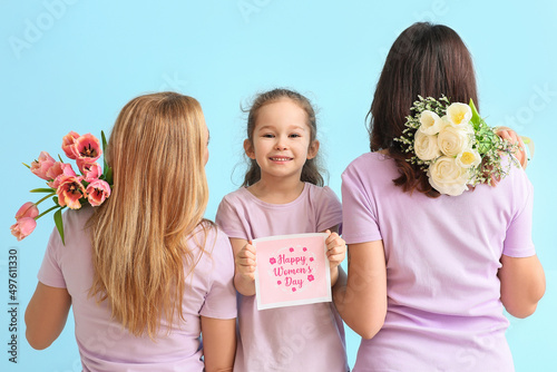 Young woman, her little dau...