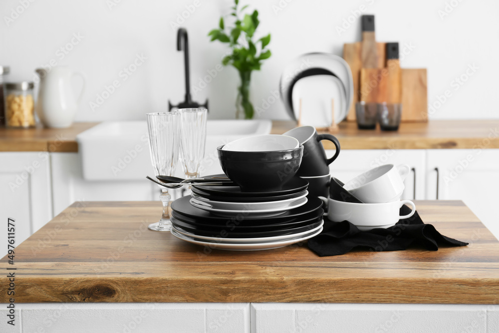 Set of clean tableware in  kitchen
