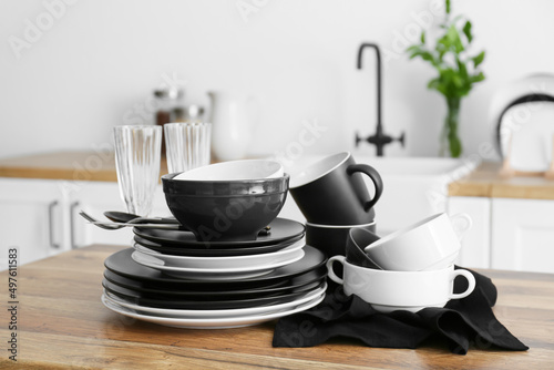 Set of clean tableware in kitchen